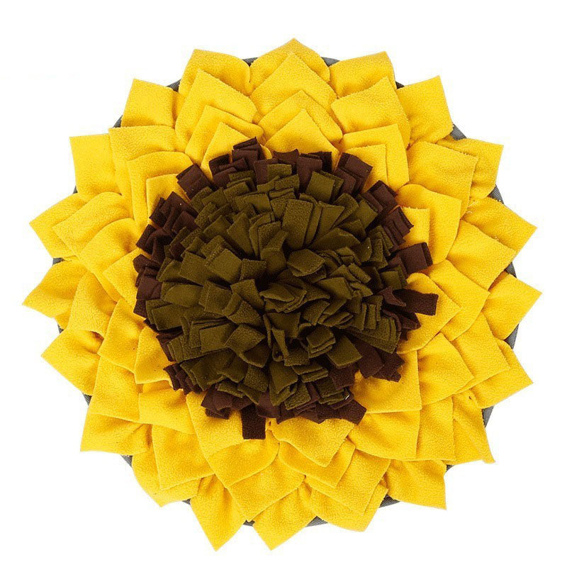 SniffNest snuffle mat in the Sunflower shape — radiating yellow petals around a dark center, top-down view